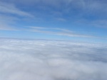 In the air above the clouds